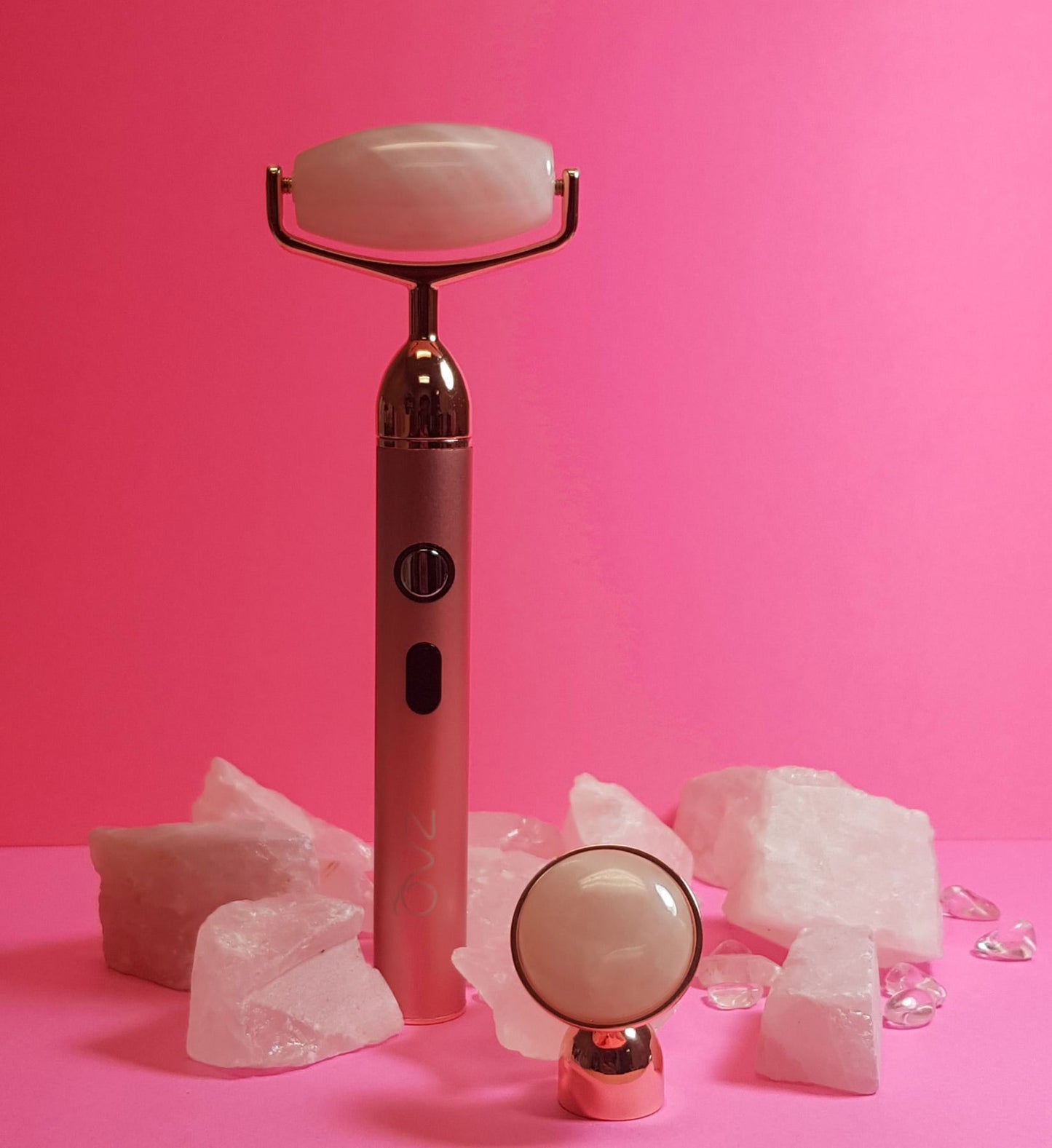 Vibrating Gemstone Roller with rose quartz in background