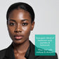Woman with a product description about skincare ingredients on a light gray background