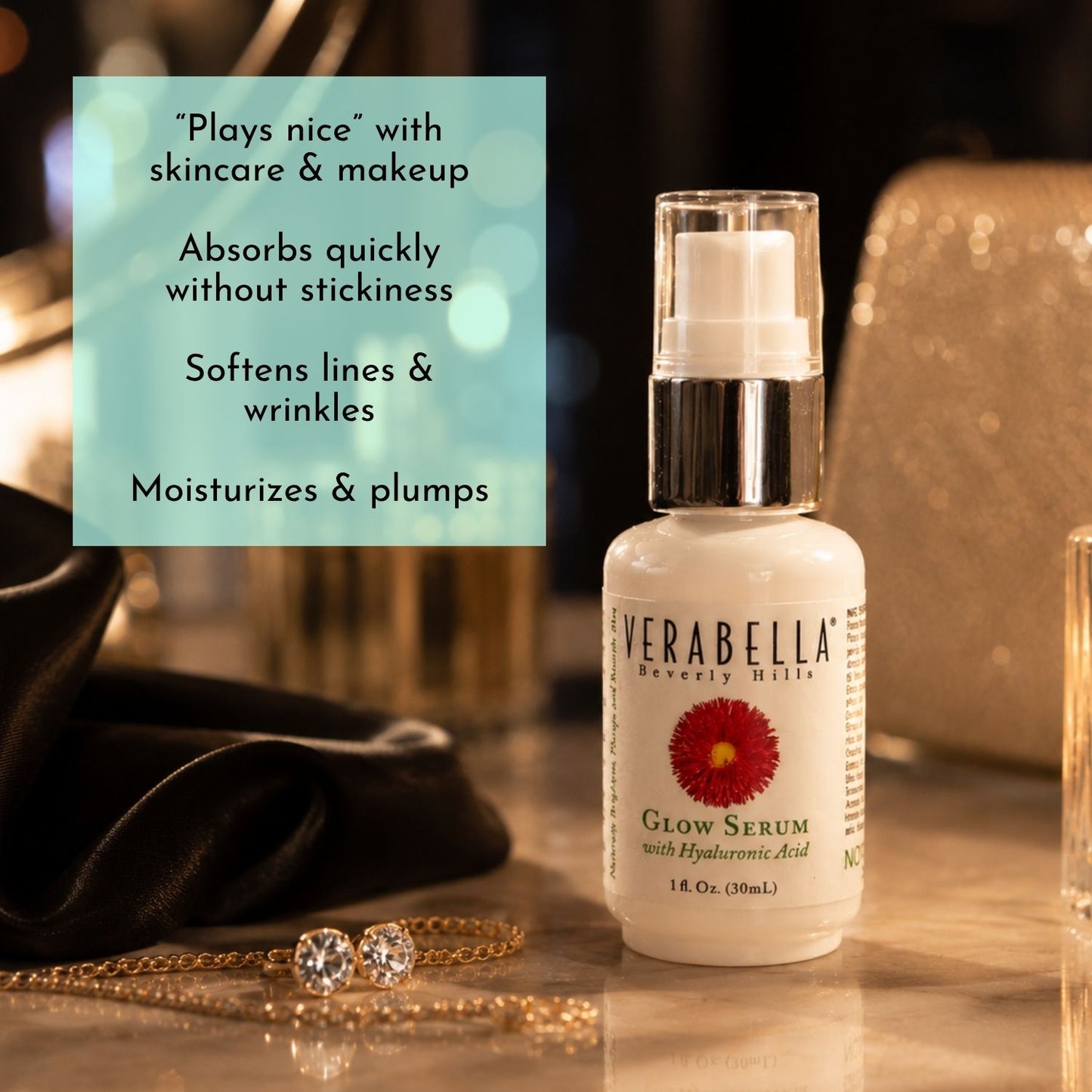 Verabella Glow Serum bottle on a reflective surface with decorative background